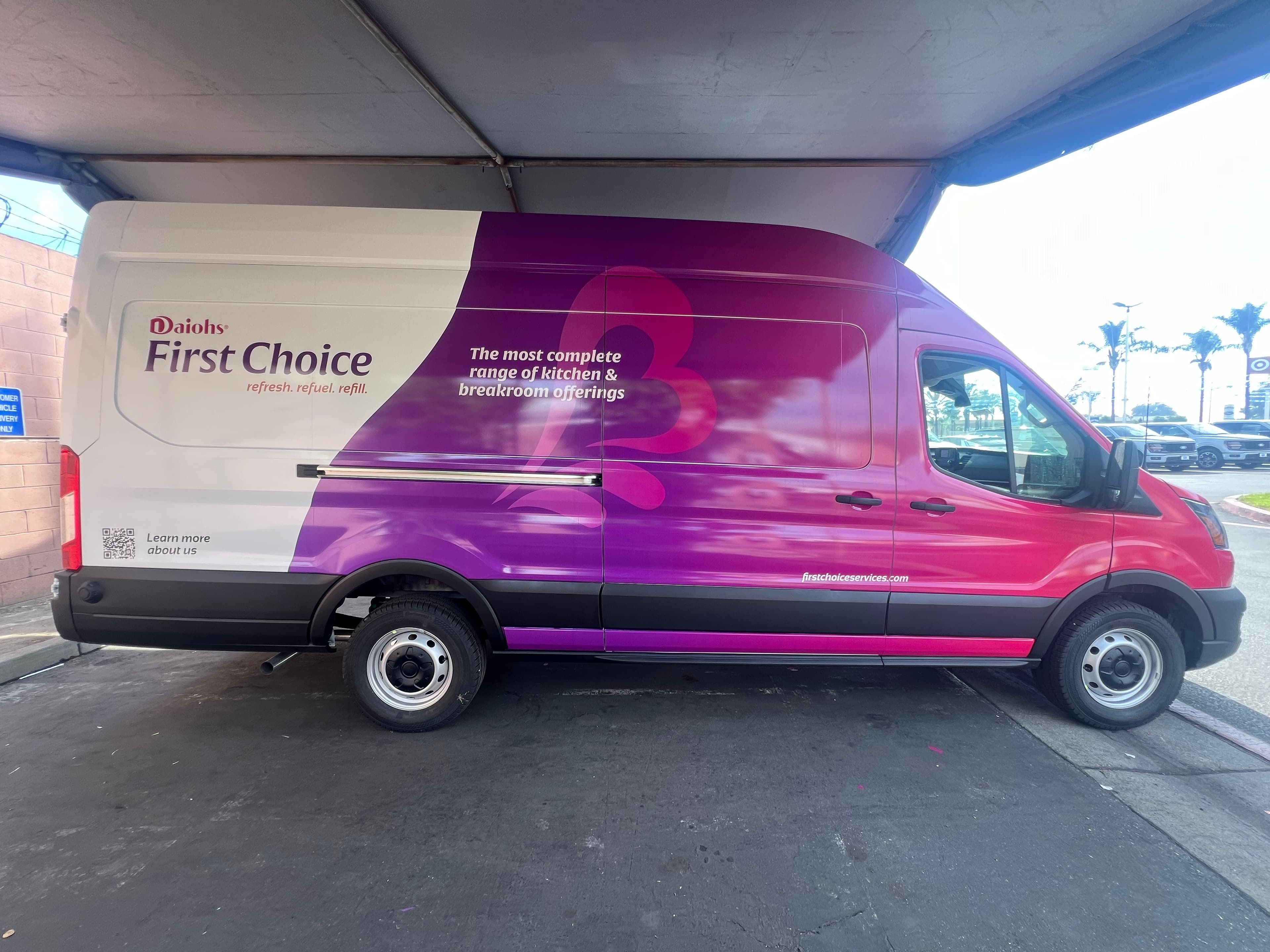 Ford Transit van wrapped in a magenta and purple gradient with the First Choice wordmark and a QR code